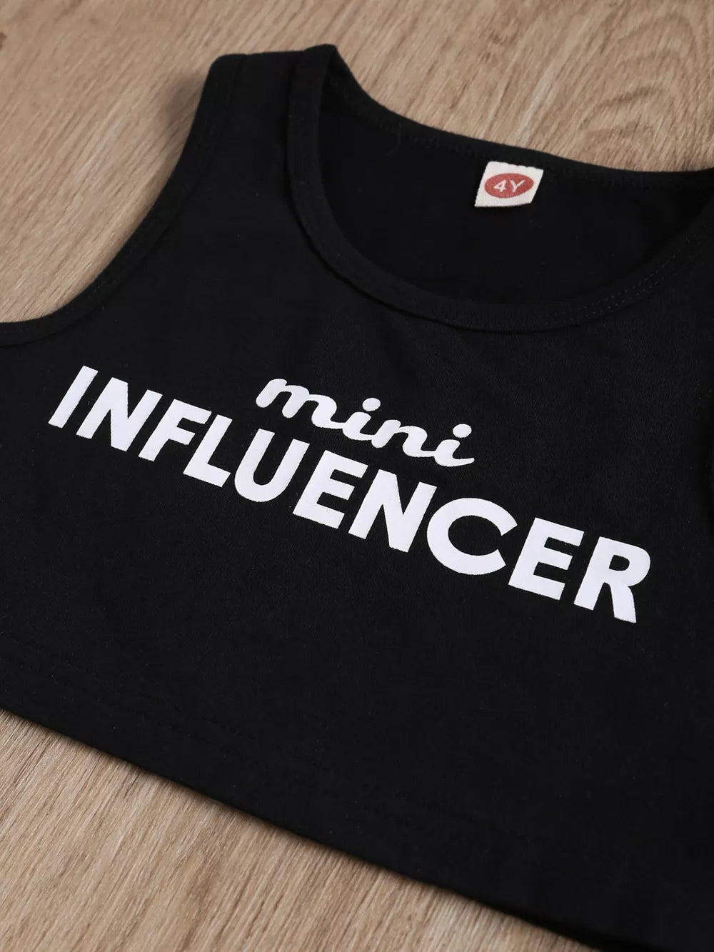 Black cotton tank top with white "mini INFLUENCER" graphic