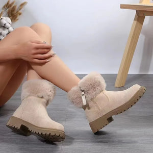 Beige suede shearling trim ankle boots with side zipper and lug sole.