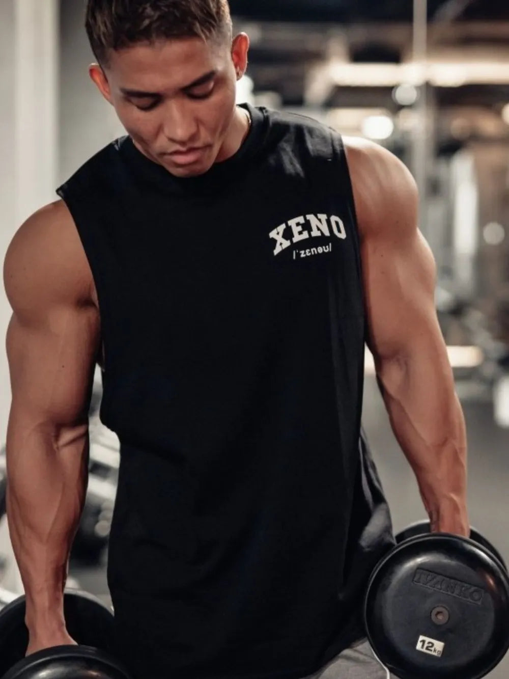 Black Xeno Tokyo graphic muscle tank top with a crew neck and sleeveless design.