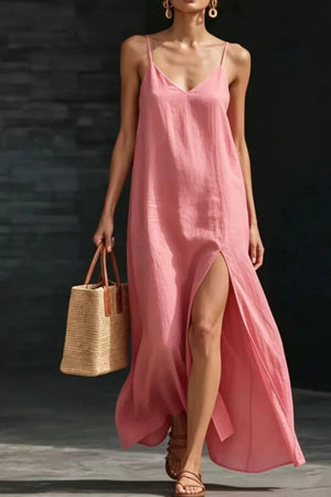 Dusty Pink V-neck maxi dress with spaghetti straps and a high slit, styled with a straw tote bag.