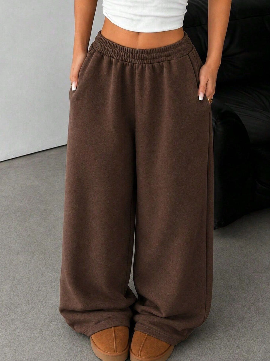 50% viscose, 50% polyester Care instructions: Machine wash cold sweatpants in Black with wide-leg silhouette
