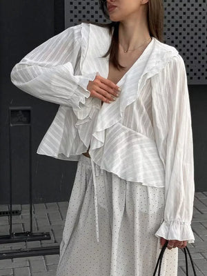 100% polyester Care instructions: Machine wash cold blouse in ivory with relaxed silhouette