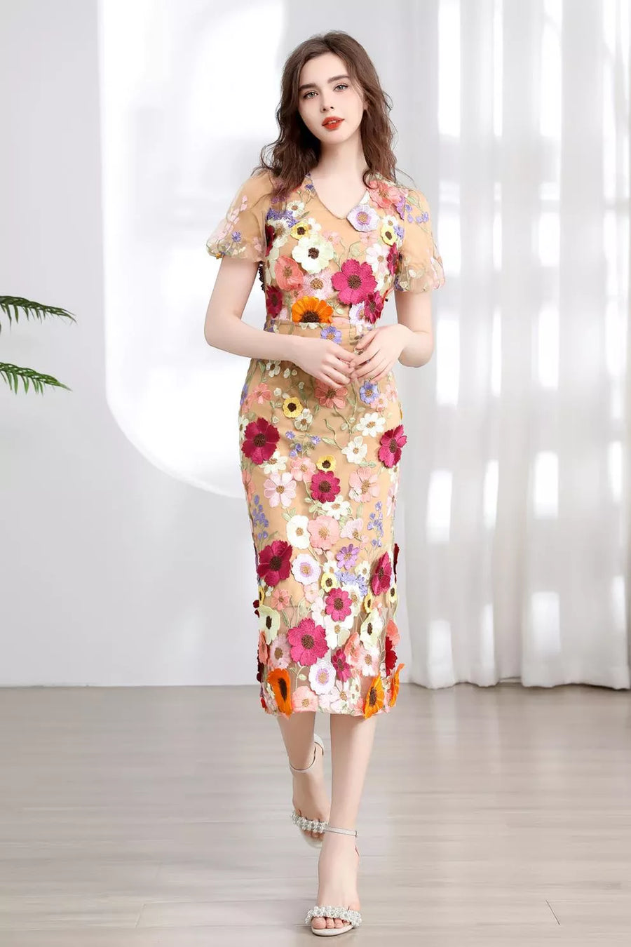 Sheath dress in sheer nude with colorful floral embroidery, V-neck, short sleeves, knee-length.