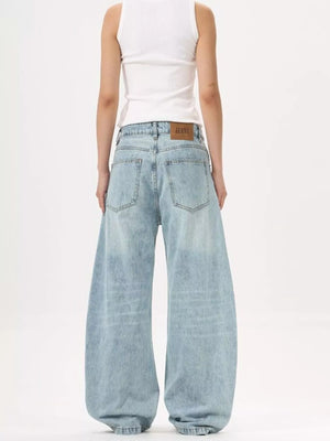 Men's light blue wide-leg stretch jeans with a classic silhouette.