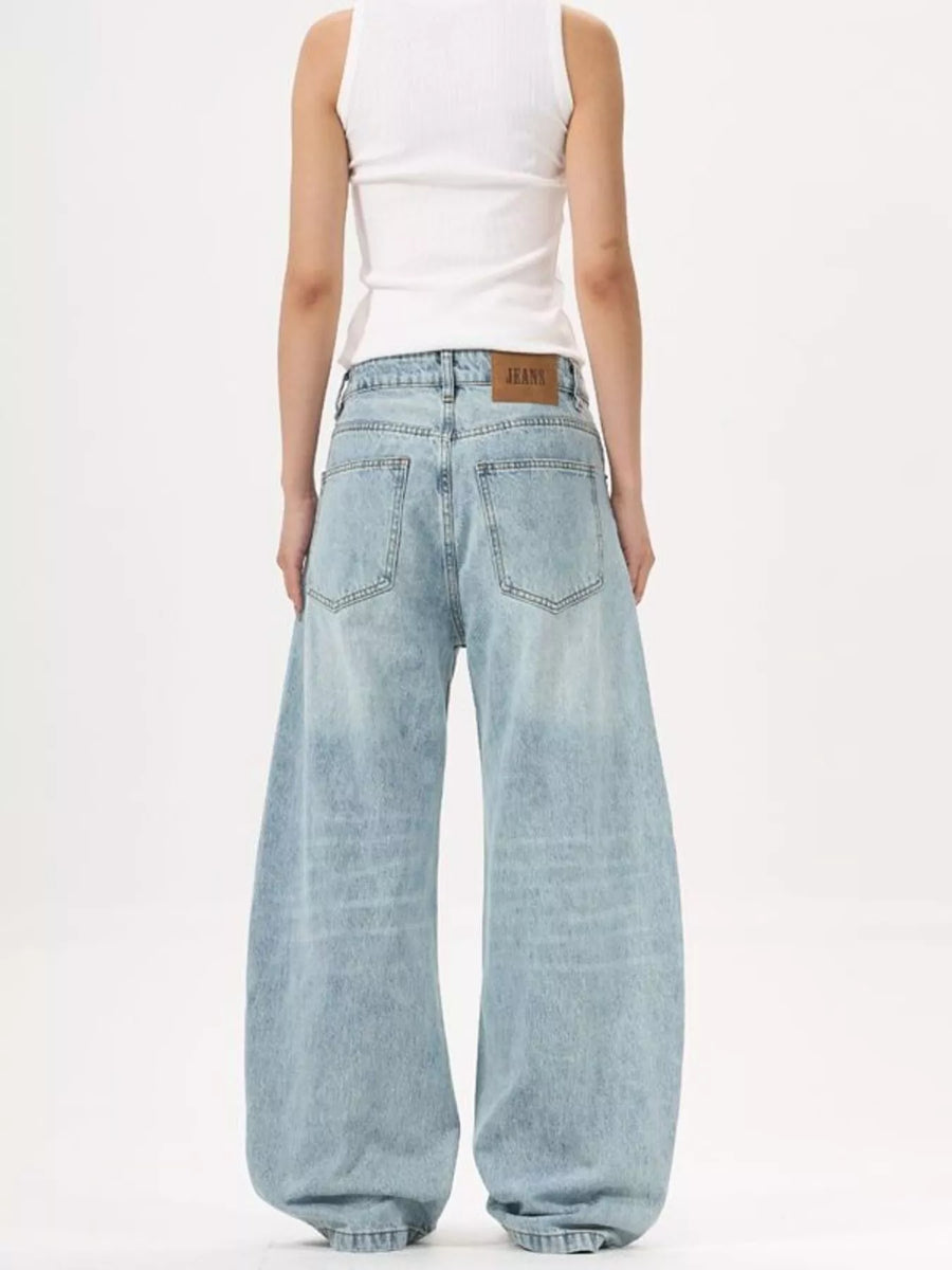 Men's light blue wide-leg stretch jeans with a classic silhouette.