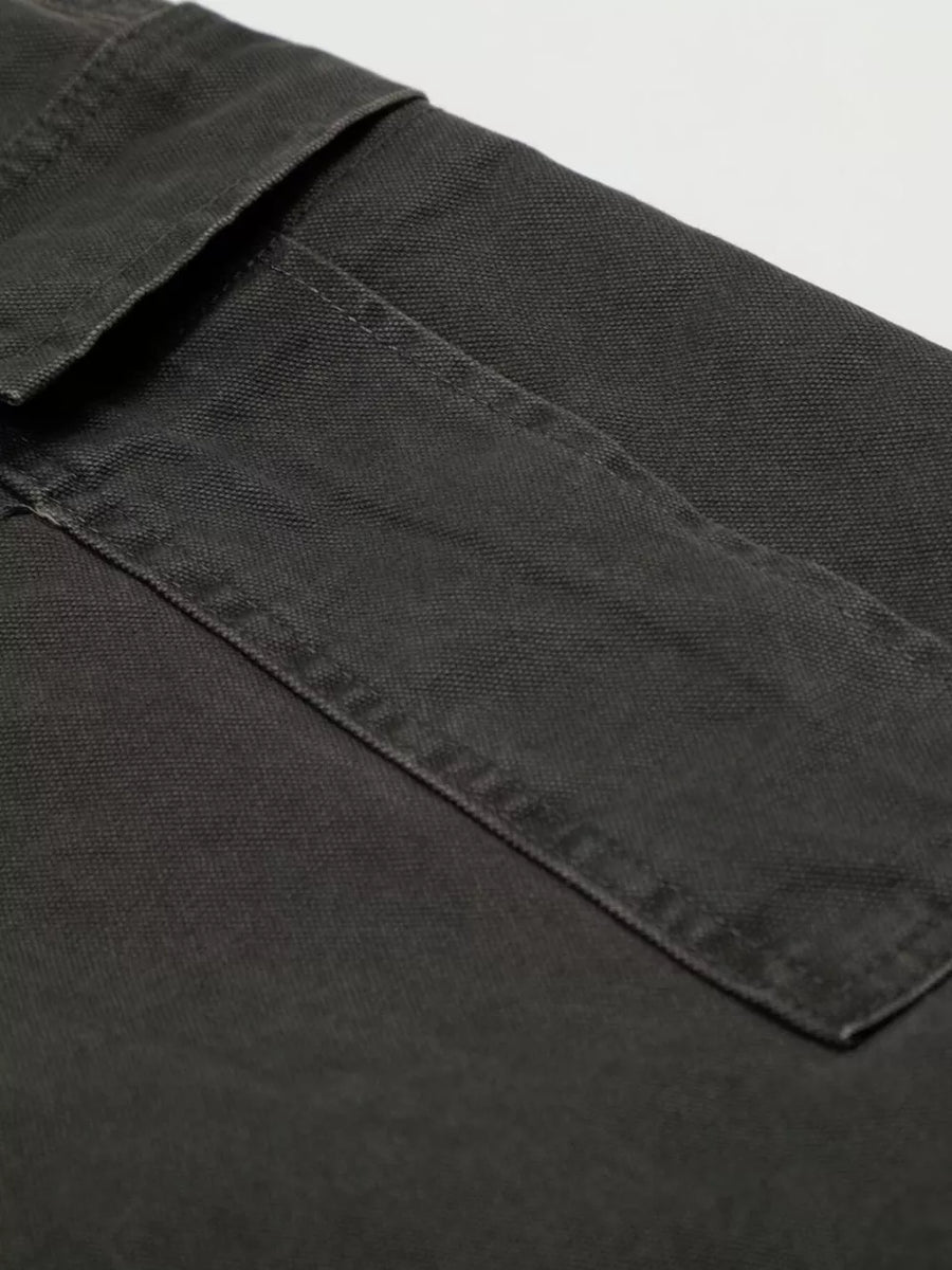 Grey cargo pants with flap pocket detail and visible stitching.