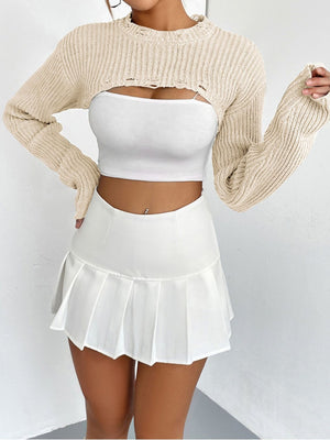 Cream distressed knit bolero crop top with ripped details and long sleeves.