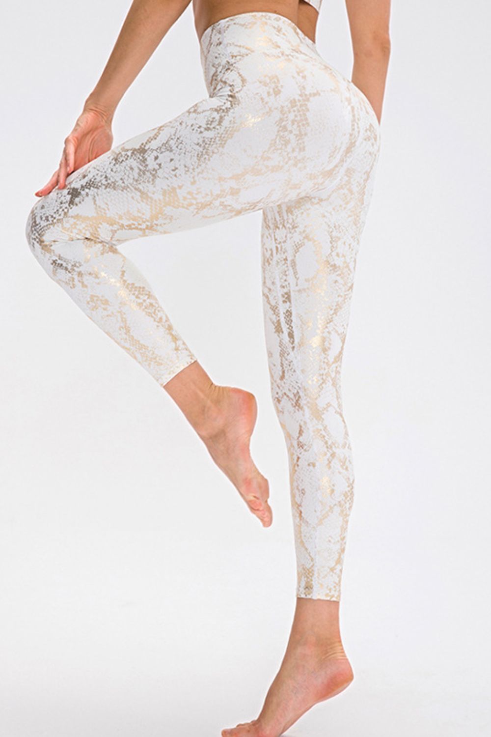 White python foil leggings with a high waist and full length.