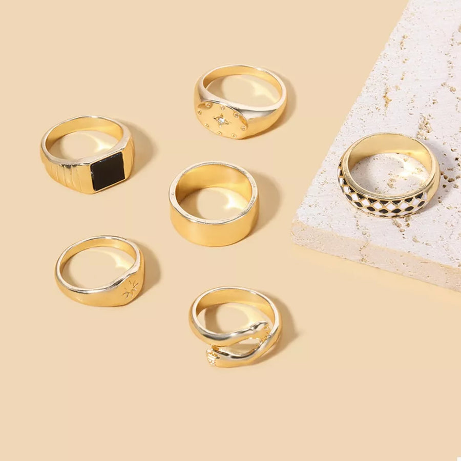 black ring featuring gold-plated and geometric