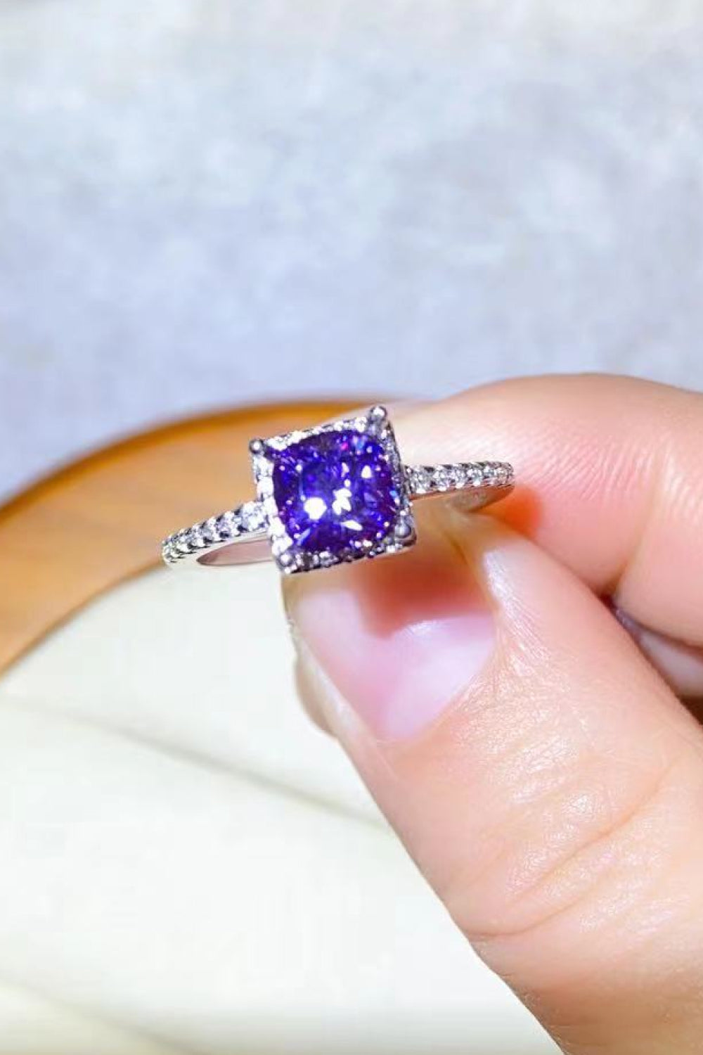 Purple cushion-cut moissanite halo ring with diamond band