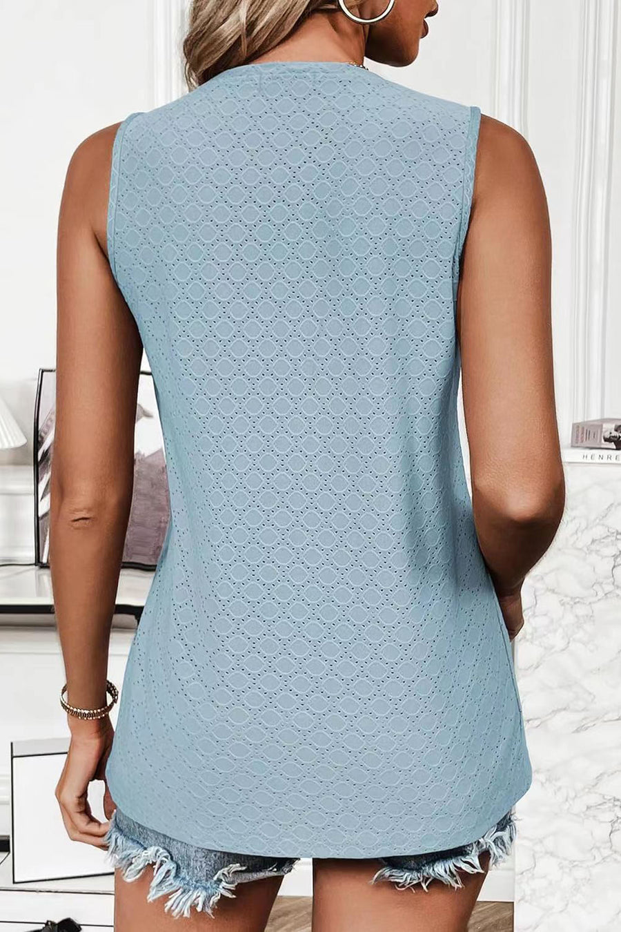 Light blue textured sleeveless scoop neck top with eyelet detail