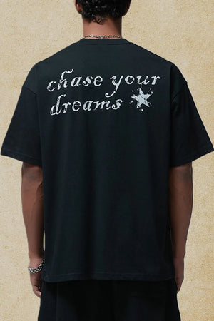 Black graphic t-shirt with white "chase your dreams" text and star graphic on back.