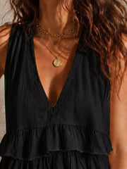 Black ruffled V-neck tank top with tiered hem detail.