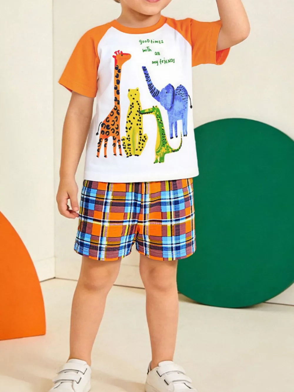 Baby boys' graphic tee with animal friends and plaid shorts.
