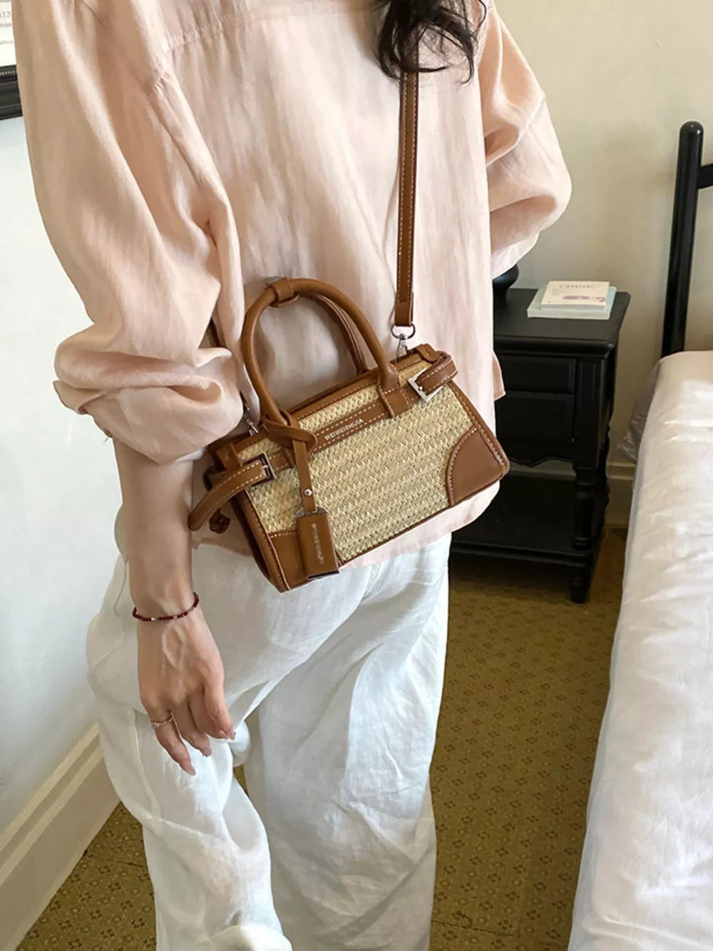 crossbody bag in tan featuring adjustable strap and structured fit
