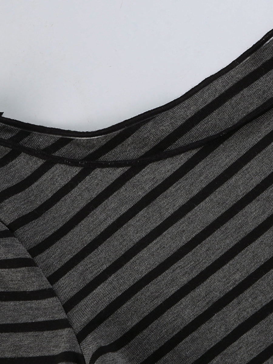 Gray and black striped t-shirt with boat neck and stretchy knit fabric.