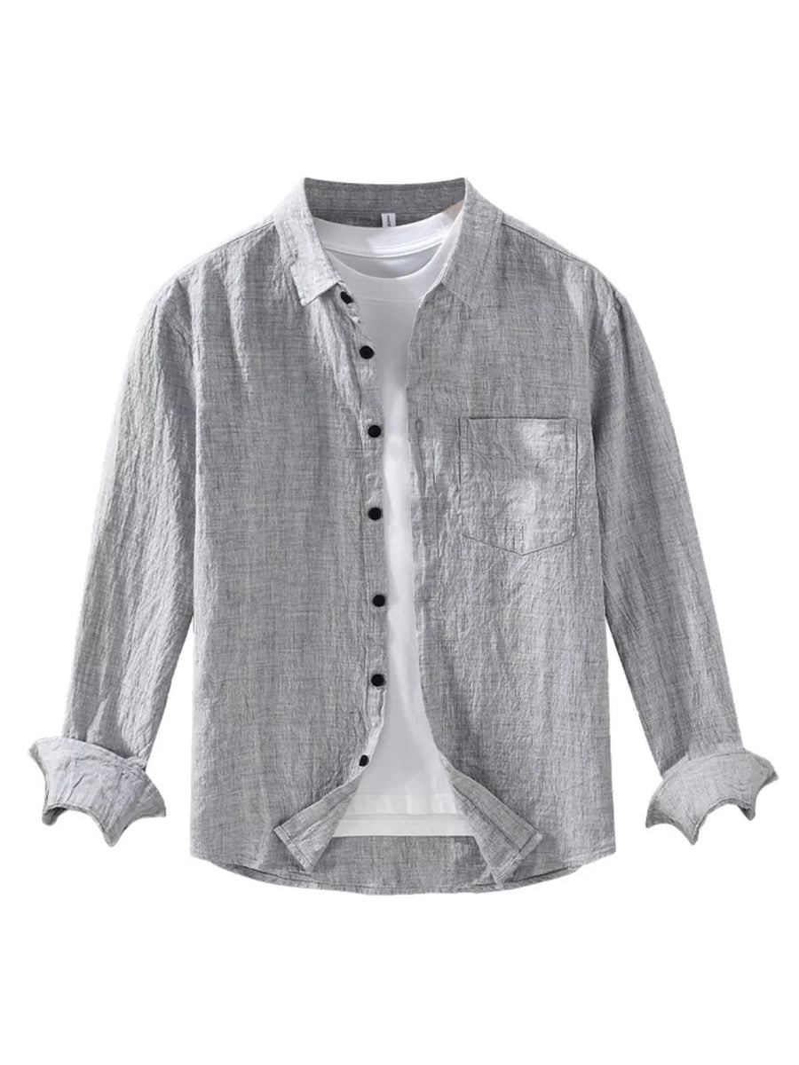 Grey linen textured long sleeve button-up shirt with chest pocket and rolled cuffs.