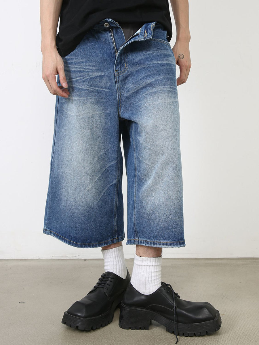 Blue wide leg cropped denim jeans with faded wash