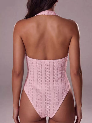 Pink lace halter bodysuit with a geometric pattern and high-cut leg.