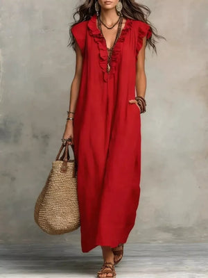 Red ruffled V-neck maxi dress with pockets and short sleeves.