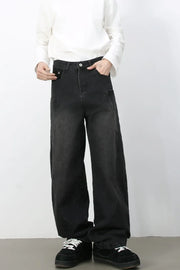 Black denim baggy trousers with a relaxed fit and unique seam details.