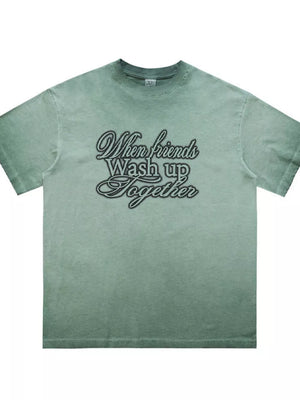 Green vintage wash graphic tee for men with crew neck and script text design.