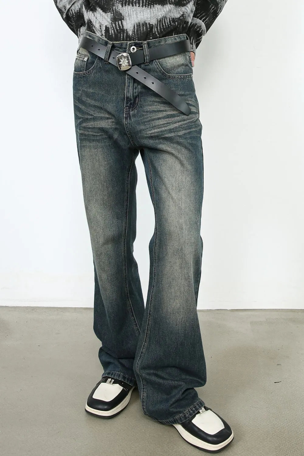 Faded flare denim jeans in dark vintage wash with a bootcut leg.