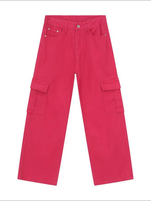 Oversized cargo denim trousers in hot pink with multiple pockets.