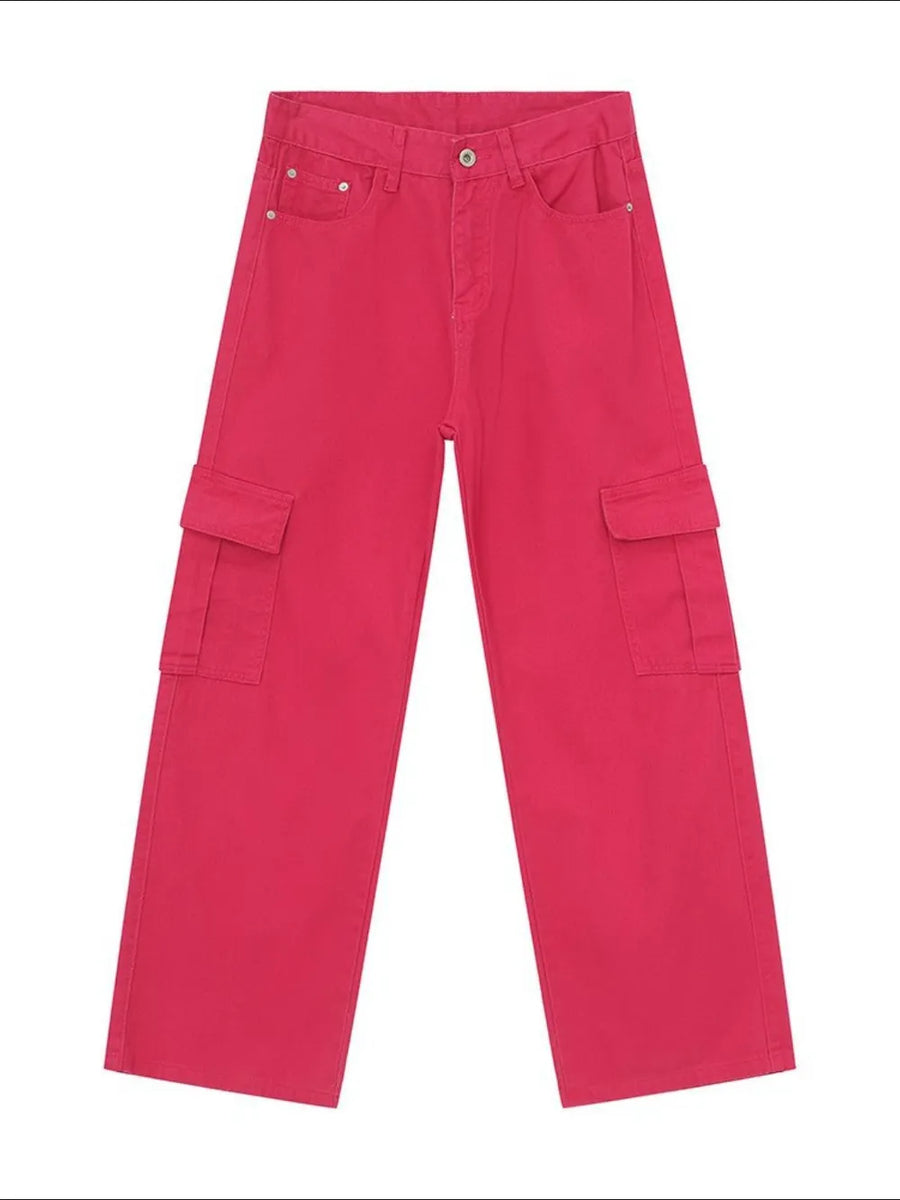 Oversized cargo denim trousers in hot pink with multiple pockets.