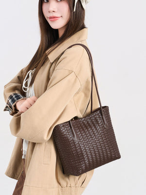 shoulder bag in dark brown featuring woven texture and boxy fit