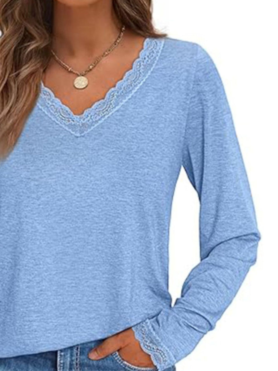Light blue long sleeve t-shirt with lace trim V-neck and cuffs.