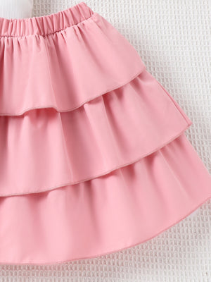 Pink tiered ruffle skirt with elastic waistband for baby girls.