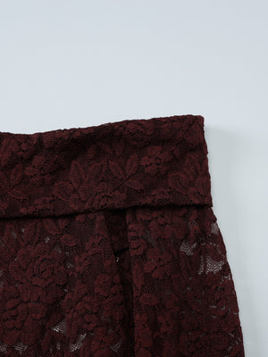 Sheer lace one-shoulder top in burgundy with floral pattern and wide neckline detail.