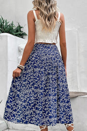 Ditsy floral midi skirt in blue with a slit, flowy A-line cut.