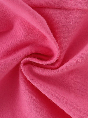 Toddler cotton tee and shorts set in bright pink, showing fabric texture.