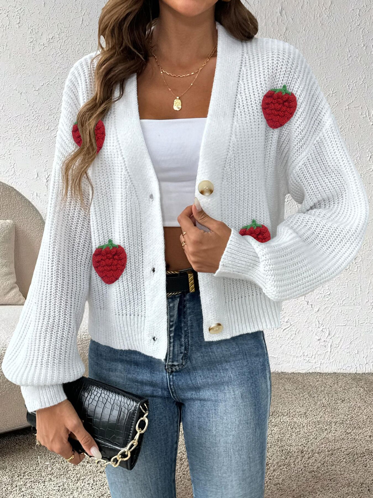 cardigan in ivory featuring ribbed and relaxed fit