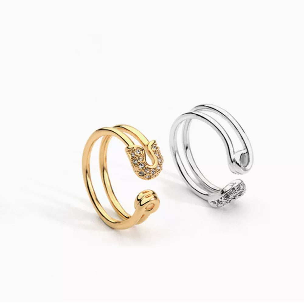 Gold and silver double band rings with zircon-embellished safety pin detail