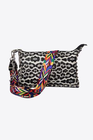 Leopard print studded shoulder bag with colorful woven strap and chain detail