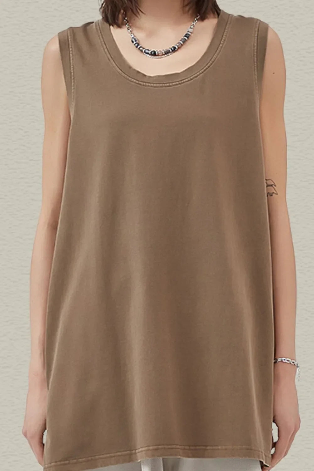 Relaxed olive brown tank top with a scoop neck and raw hem detail.