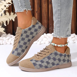 Chic lace-up sneakers in khaki with a blue monogram pattern and tan suede accents.
