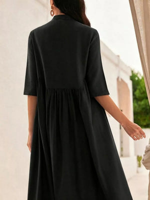 Black midi dress with stand collar, button-down front, and gathered waist