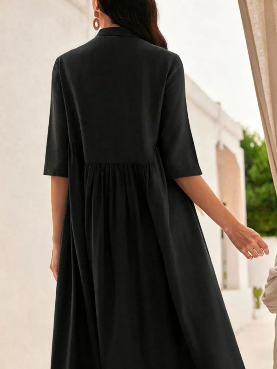 Black midi dress with stand collar, button-down front, and gathered waist