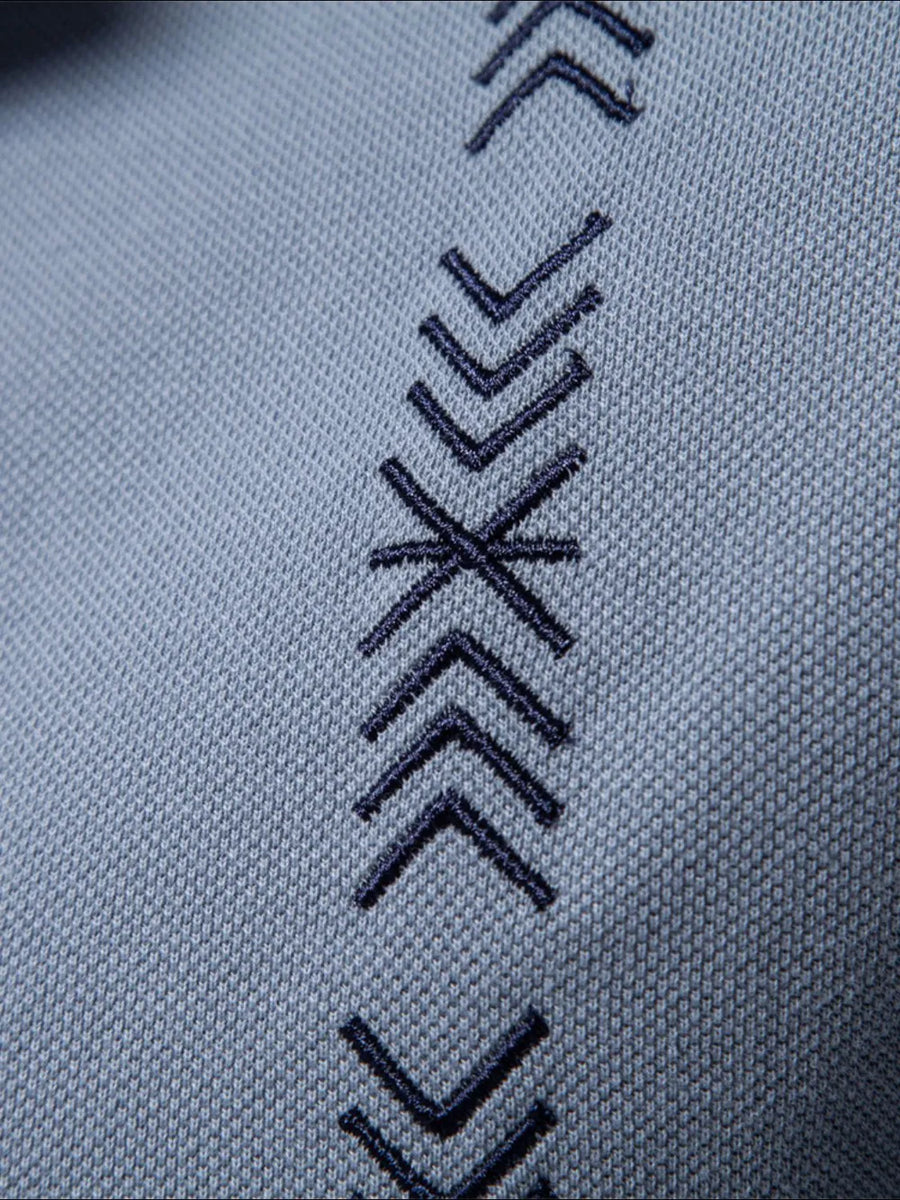 Dusty blue piqué polo shirt with embroidered chevron detail