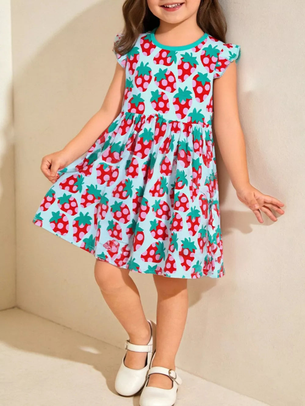 Baby dress with strawberry print, ruffle sleeves, and gathered skirt.