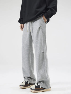 Grey casual loose-fit sweatpants with drawstring and pockets.