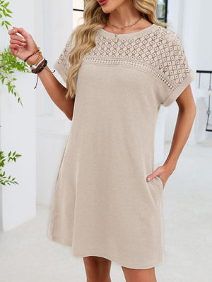 Beige t-shirt dress with short sleeves and a sheer lace yoke detail.