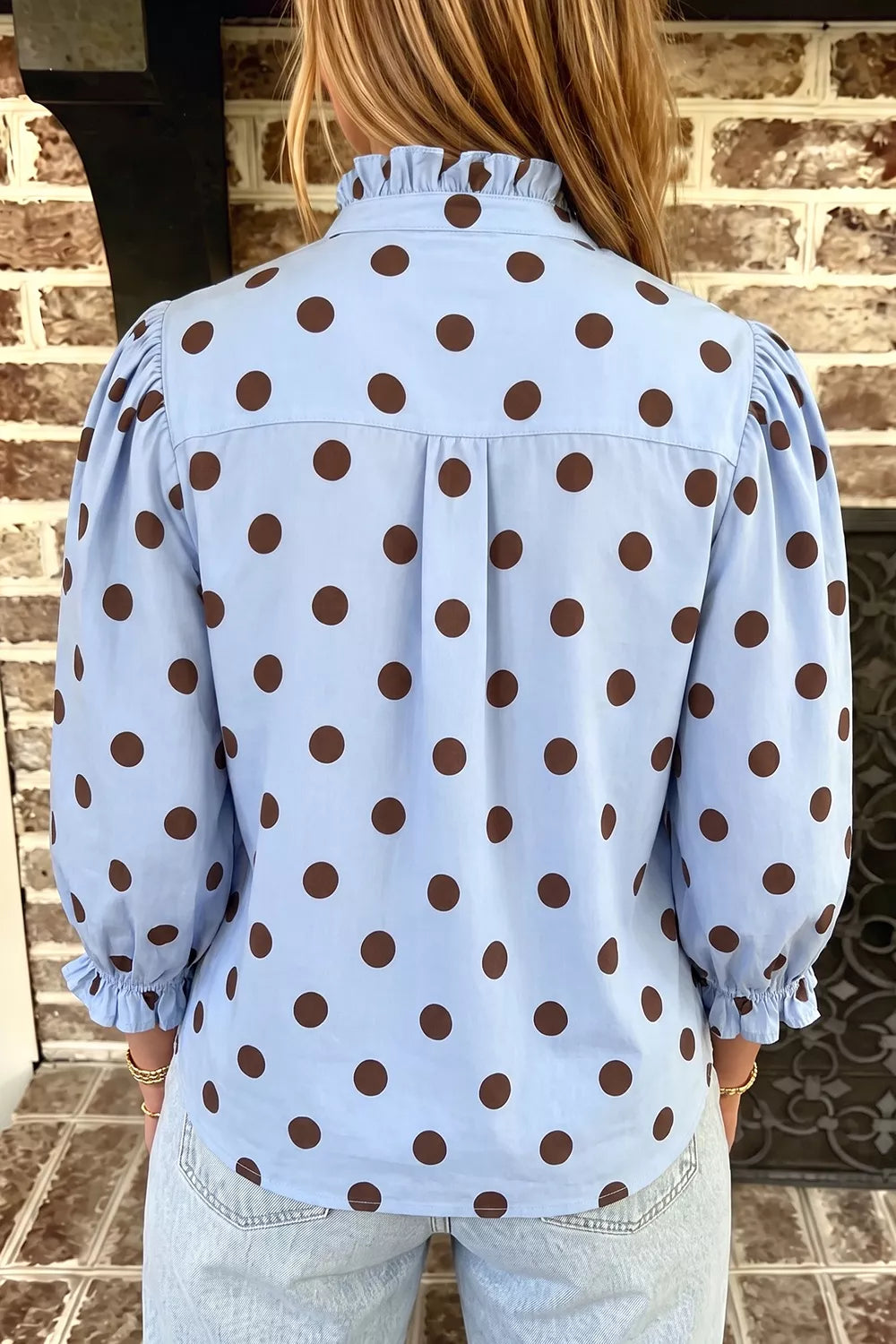 brown blouse featuring buttoned and polka dot