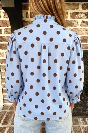 brown blouse featuring buttoned and polka dot