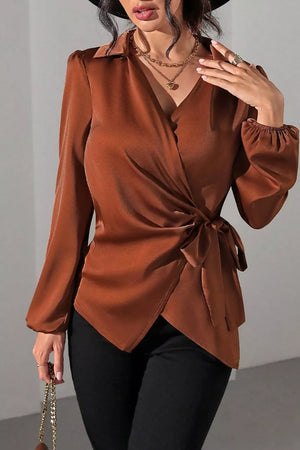 blouse in rust featuring tied waist and fitted fit