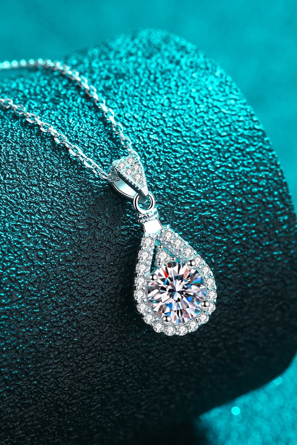 Silver teardrop necklace with halo moissanite and pave accents.